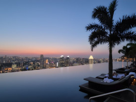 Marina Bay Sands SkyPark view at sunset with city lights and bay panorama