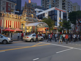Little India jasmine garland shops at night with temple lights and crowds]