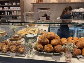 Freshly made maple pastries in a Vancouver bakery case
