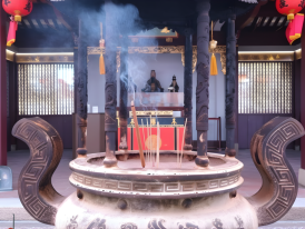 Intricate carved details and incense coils at Thian Hock Keng Temple