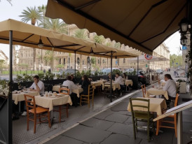 Piazza Cavour with locals at outdoor cafe tables