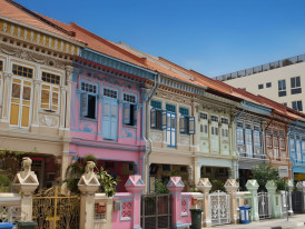 Peranakan shophouse facade with intricate hand-painted tiles and pastels