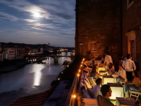 Florence's rooftops and towers glowing under moonlight