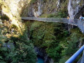Steel footbridge over turquoise gorge in Leutaschklamm