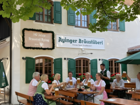 Aying village beer garden with steins and chestnut shade