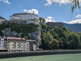 Kufstein Fortress above the Inn River with Alps behind