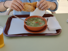 Bowl of caldo verde with chouriço slices