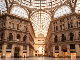 Galleria Umberto glass dome with golden afternoon light on marble floor