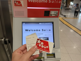 Suica IC card being purchased at a Tokyo Station ticket machine