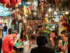 Ebisu Yokocho in Tokyo, a lively alleyway of izakayas with lanterns and locals dining
