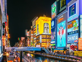 Neon signs along Dotonbori Canal at night