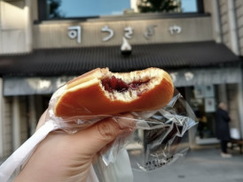 Dorayaki filled with sweet red bean paste enjoyed outside a traditional Tokyo sweets shop