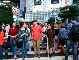 Travellers and locals crossing Shibuya Crossing in Tokyo, illustrating the energy of a first-time Japan itinerary
