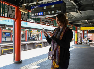 Traveler waiting at a train station in Japan