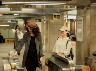 Traveler learning to navigate Kyoto, Japan with a local