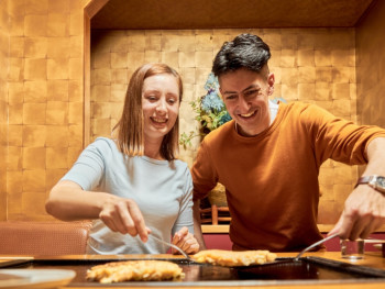 Couple enjoying a cooking class in Kyoto, Japan Couple enjoying a cooking class in Kyoto, Japan