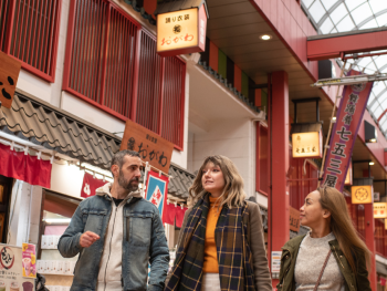 People walking through a alley in Tokyo