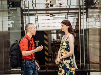 Tour guide and tourist having a conversation Tour guide and tourist having a conversation