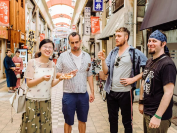 Tourists snacking in Asakusa Tourists snacking in Asakusa