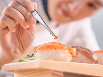 Sushi being prepared in Tokyo, Japan Sushi being prepared in Tokyo, Japan