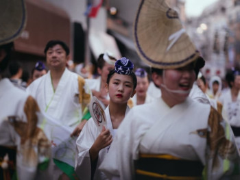 A group of Japanese people walking together A group of Japanese people walking together