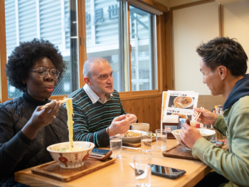 Tourists enjoying Ramen noodles in Japan Tourists enjoying Ramen noodles in Japan