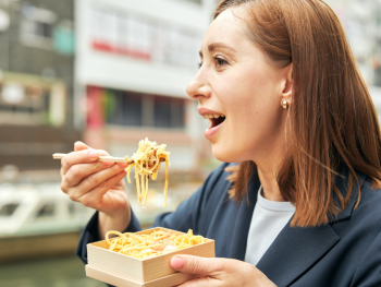 Woman enjoying the best ramen in Japan Woman enjoying the best ramen in Japan
