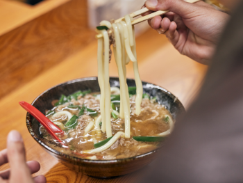 Cooked ramen in a thick broth Cooked ramen in a thick broth