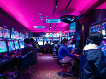 Tourists having fun at a pachinko parlor. Tourists having fun at a pachinko parlor.