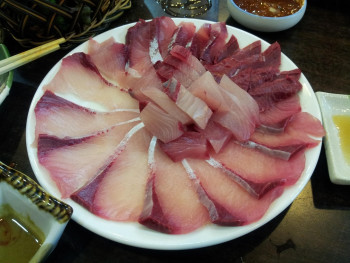 Seafood vendor arranging sashimi inside Kuromon. photo by truelife365 Pixabay Seafood vendor arranging sashimi inside Kuromon. photo by truelife365 Pixabay