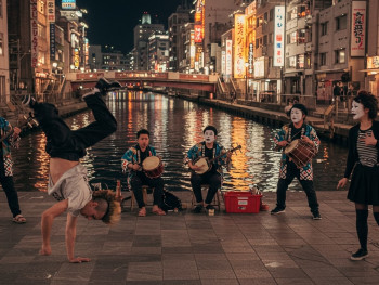 Street performers along Dotonbori River. Street performers along Dotonbori River.