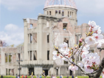 The Atomic Bomb Dome framed by cherry blossoms Photo by HONG FENG on Unsplash The Atomic Bomb Dome framed by cherry blossoms Photo by HONG FENG on Unsplash