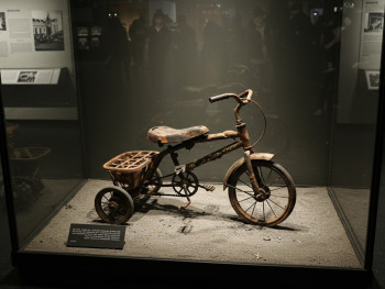 A charred tricycle on display hiroshima museum exhibit A charred tricycle on display hiroshima museum exhibit