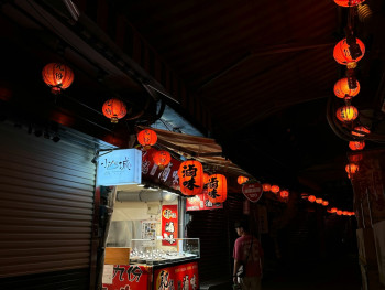 Lanterns glowing over food signage in evening atmosphere photo by Kang Jie Unsplash