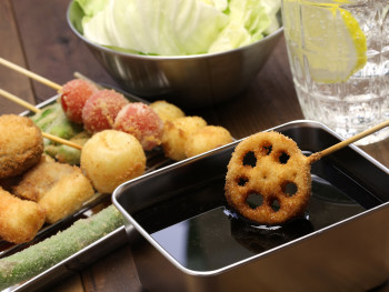 Plate of assorted deep-fried skewers