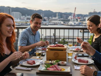 Travelers enjoying premium Kobe beef tasting experience with harbor views in background Travelers enjoying premium Kobe beef tasting experience with harbor views in background
