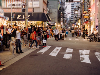 Colorful street art and youth fashion in Americamura district with young people shopping and hanging out.