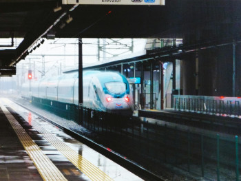 A sleek bullet train pulling into Shin-Osaka Station with its distinctive white and blue design Photo by Büşra Salkım on Unsplash A sleek bullet train pulling into Shin-Osaka Station with its distinctive white and blue design Photo by Büşra Salkım on Unsplash
