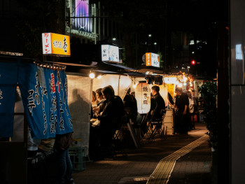 Busy night street scene with illuminated food stalls and crowds of people Photo by Nichika Sakurai on Unsplash Busy night street scene with illuminated food stalls and crowds of people Photo by Nichika Sakurai on Unsplash