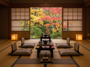 A traditional tea ceremony setup on tatami mats with autumn leaves visible through open shoji screens A traditional tea ceremony setup on tatami mats with autumn leaves visible through open shoji screens