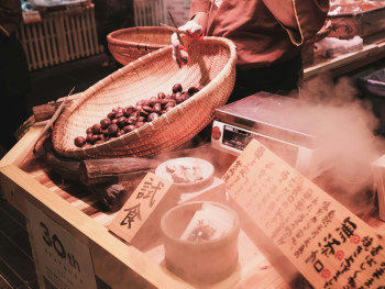 A busy evening food market scene with steam rising from cooking stalls and customers enjoying autumn weather while trying different foods Photo by Florian Hahn on Unsplash A busy evening food market scene with steam rising from cooking stalls and customers enjoying autumn weather while trying different foods Photo by Florian Hahn on Unsplash