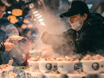 Steam rising from hot takoyaki being prepared at a Kuromon Ichiba Market stall, with customers huddled around for warmth Photo by zhang kaiyv on pexels Steam rising from hot takoyaki being prepared at a Kuromon Ichiba Market stall, with customers huddled around for warmth Photo by zhang kaiyv on pexels