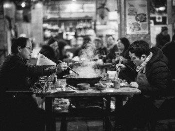 A traditional hot pot setup in an Osaka restaurant, with friends gathered around the steaming pot sharing food and conversation Photo by AG Z on pexels A traditional hot pot setup in an Osaka restaurant, with friends gathered around the steaming pot sharing food and conversation Photo by AG Z on pexels