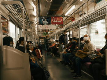 Interior of a local train with people reading or napping Photo by Micah Camper on Unsplash Interior of a local train with people reading or napping Photo by Micah Camper on Unsplash