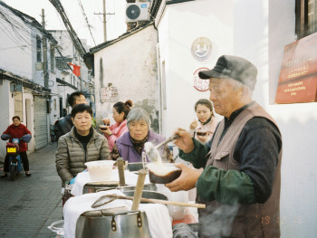 Elderly vendor preparing traditional street food Photo by chenou pan on Unsplash Elderly vendor preparing traditional street food Photo by chenou pan on Unsplash