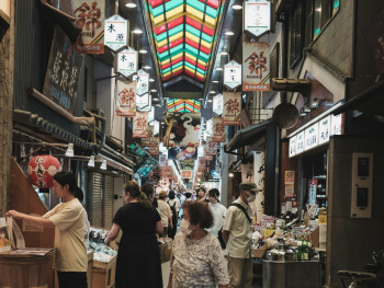 Traditional shopping street with food vendors. Photo by Florian Hahn on Unsplash Traditional shopping street with food vendors. Photo by Florian Hahn on Unsplash