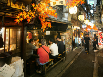 Outdoor seating area with locals enjoying drinks and yakitori, creating intimate neighborhood atmosphere. Photo by Philip Ho on Unsplash Outdoor seating area with locals enjoying drinks and yakitori, creating intimate neighborhood atmosphere. Photo by Philip Ho on Unsplash