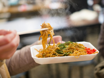 Local businessman enjoying street food Local businessman enjoying street food