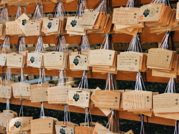 Wooden prayer plaques (ema) with hair-related wishes written on them.Photo by Wan Chen on Unsplash Wooden prayer plaques (ema) with hair-related wishes written on them.Photo by Wan Chen on Unsplash