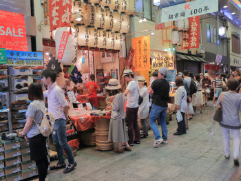 Nishiki Market with vendors and souvenir shops in the distance. Nishiki Market with vendors and souvenir shops in the distance.